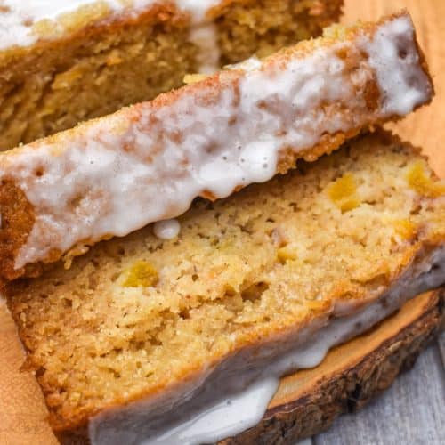 slices of glazed peach bread on a wooden cutting board