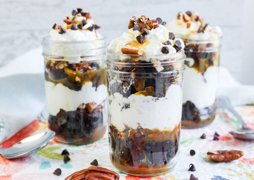 turtle brownie trifles in small glass jars