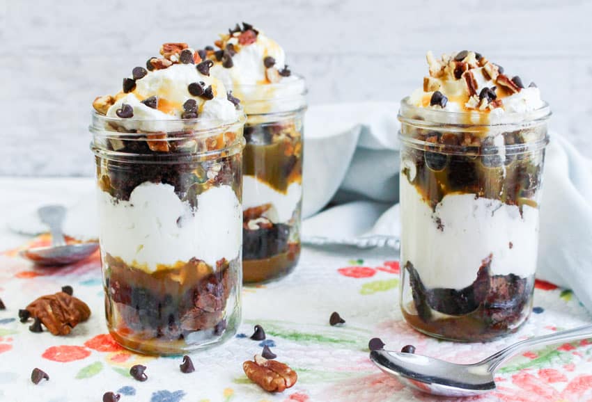 turtle brownie trifles in small glass jars