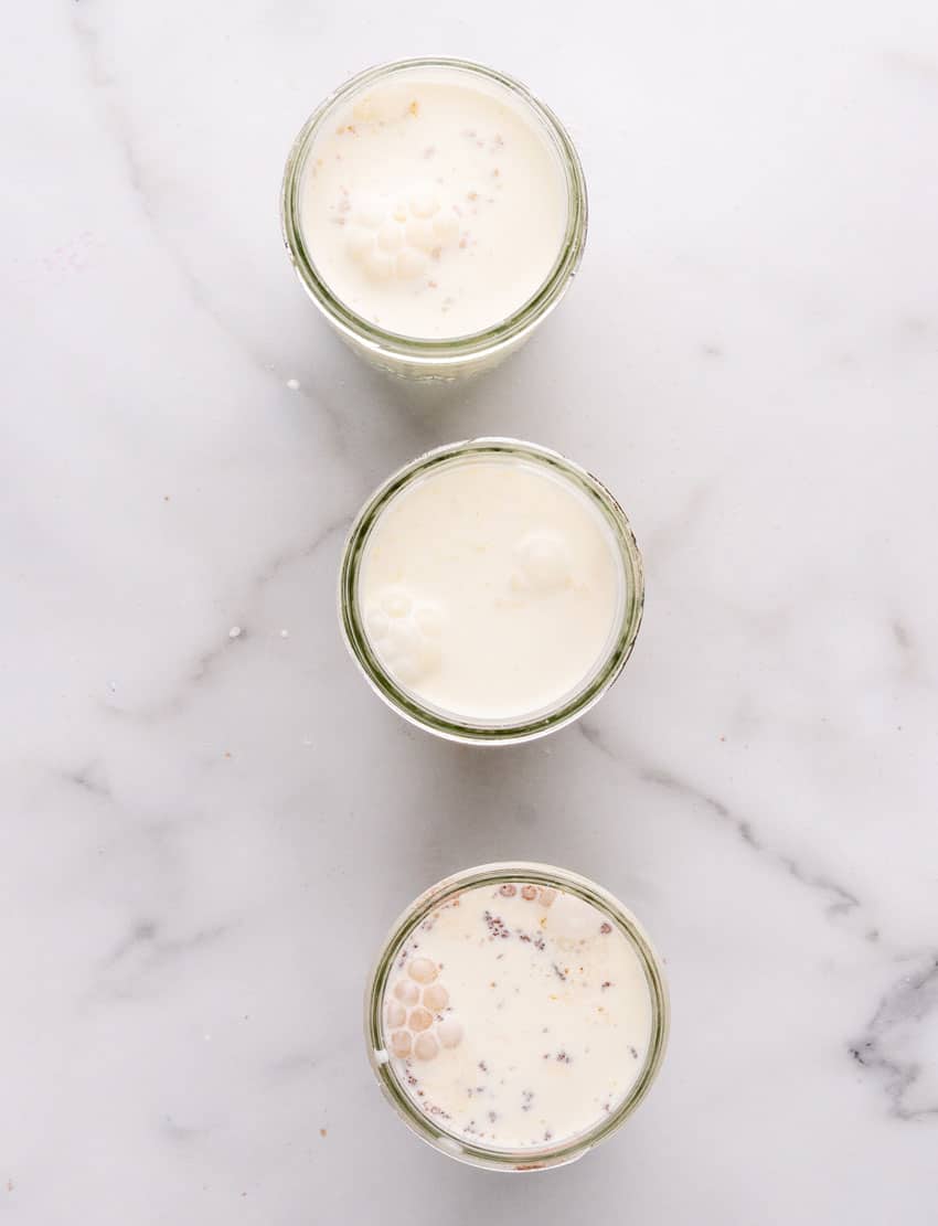 heavy cream and pudding mix in three small glass mason jars