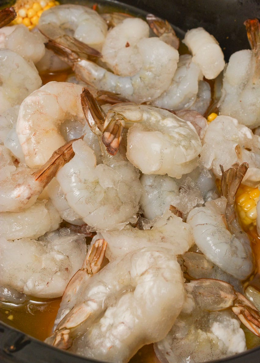 raw shrimp in a black crockpot