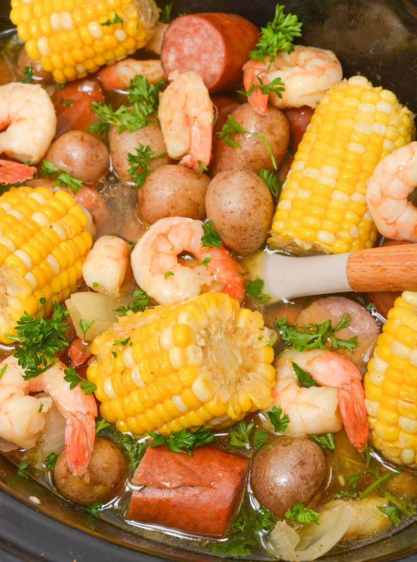 an easy shrimp boil in the bowl of a slow cooker