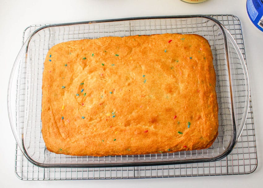 a baked funfetti cake in a glass baking dish