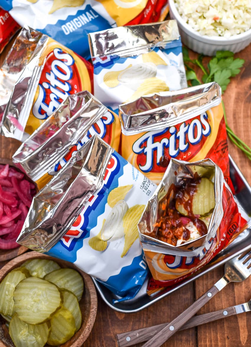 pulled pork walking tacos on a metal tray