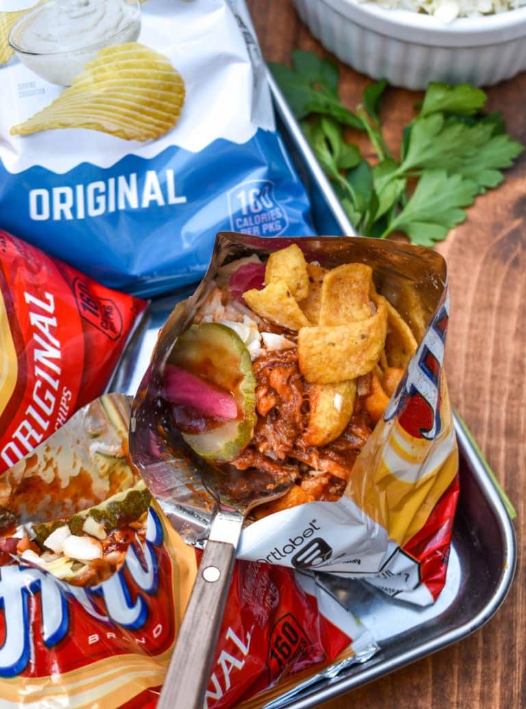 pulled pork walking tacos on a metal tray