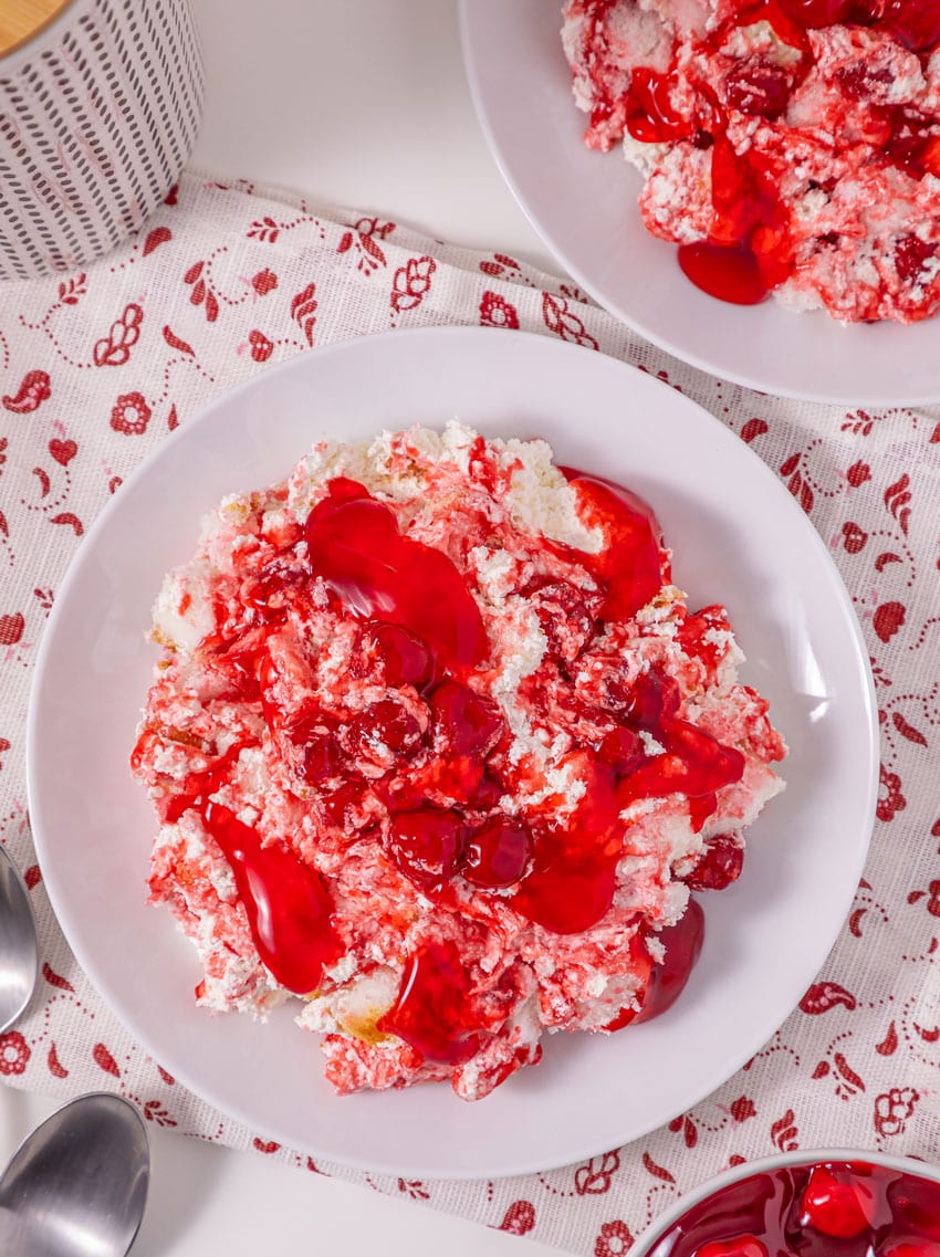 old fashioned cherries in the snow dessert in two shallow white bowls