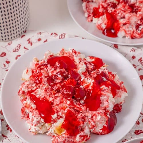 old fashioned cherries in the snow dessert in two shallow white bowls