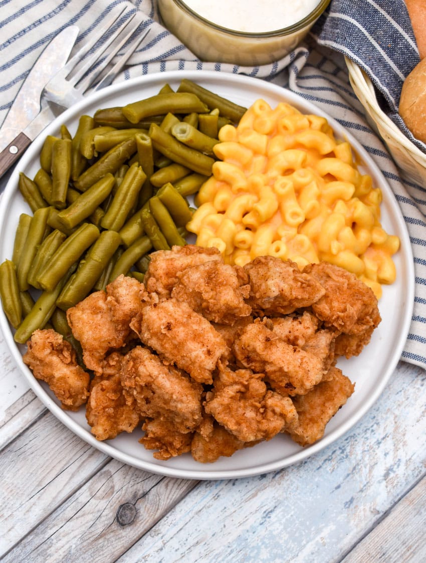 country fried pork nuggets on a white plate