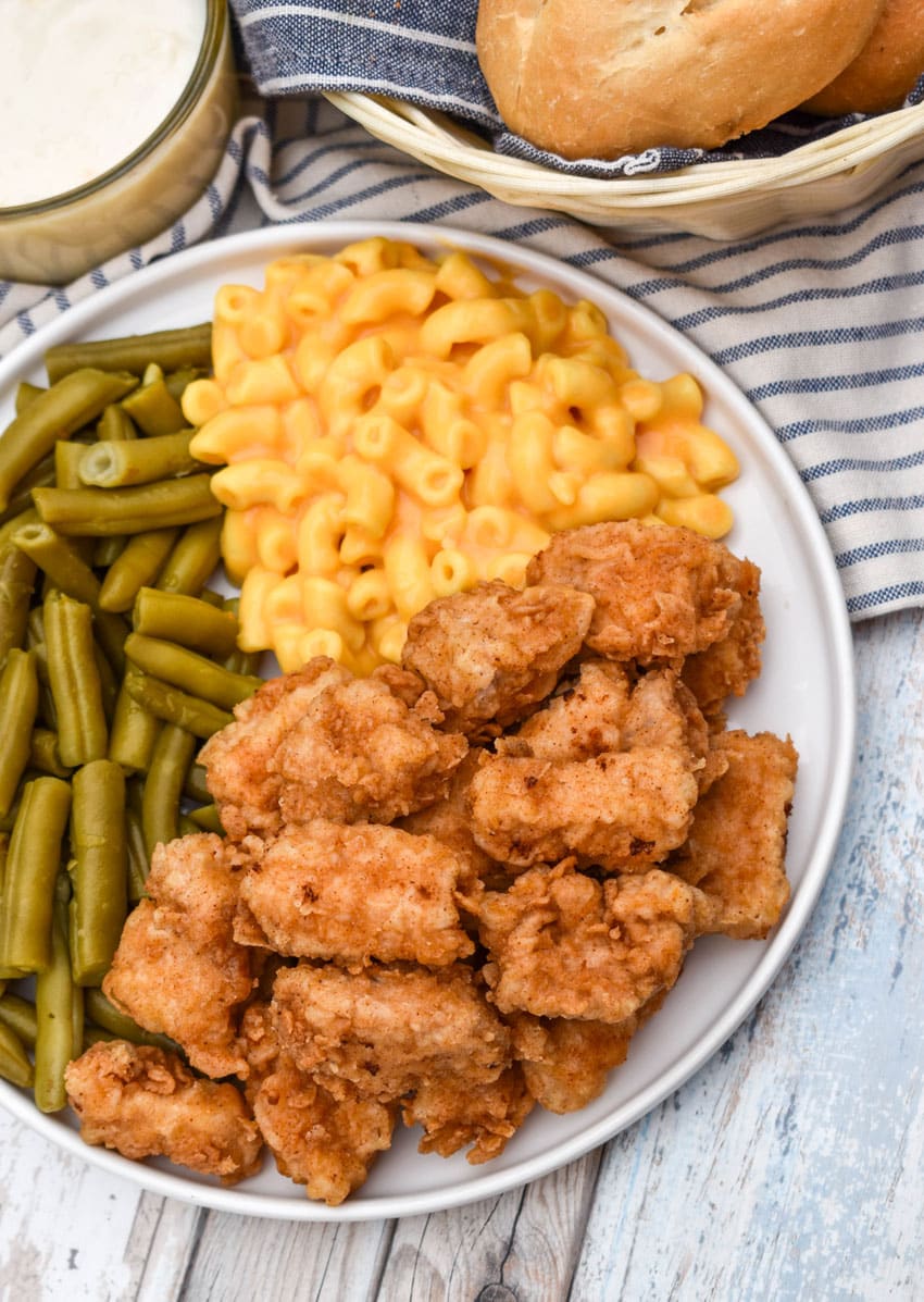country fried pork nuggets on a white plate