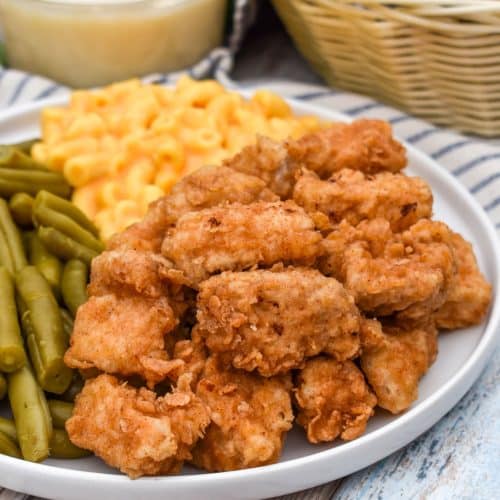 country fried pork nuggets on a white plate