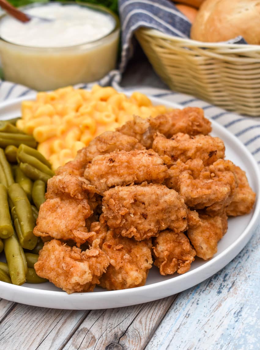 country fried pork nuggets on a white plate