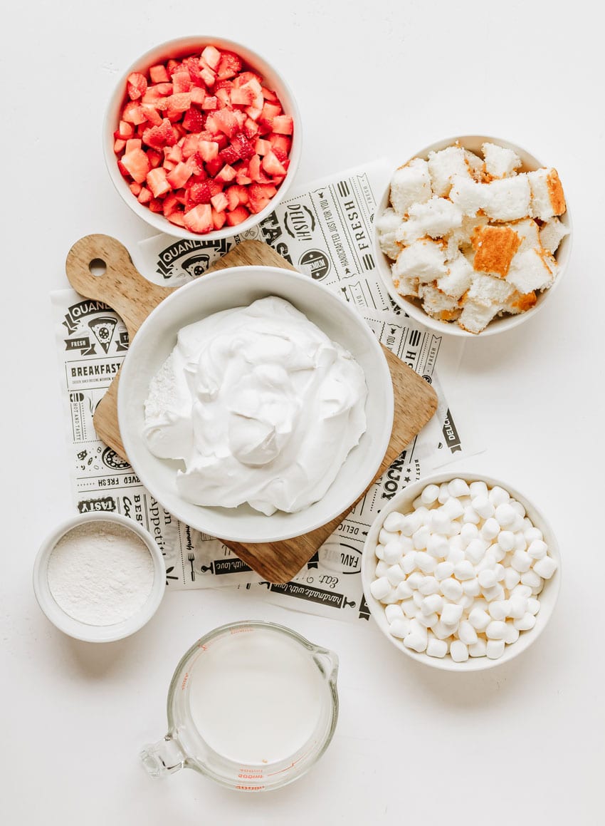 an overhead image showing the measured ingredients needed to make a batch of strawberry shortcake fluff salad