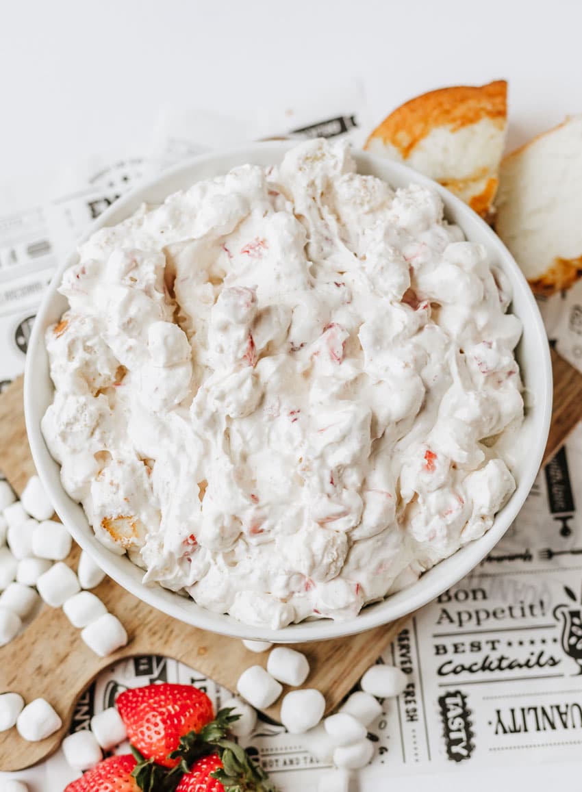 strawberry shortcake fluff salad in a white serving bowl