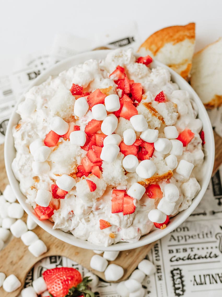 strawberry shortcake fluff salad in a white serving bowl