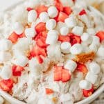 strawberry shortcake fluff salad in a white serving bowl