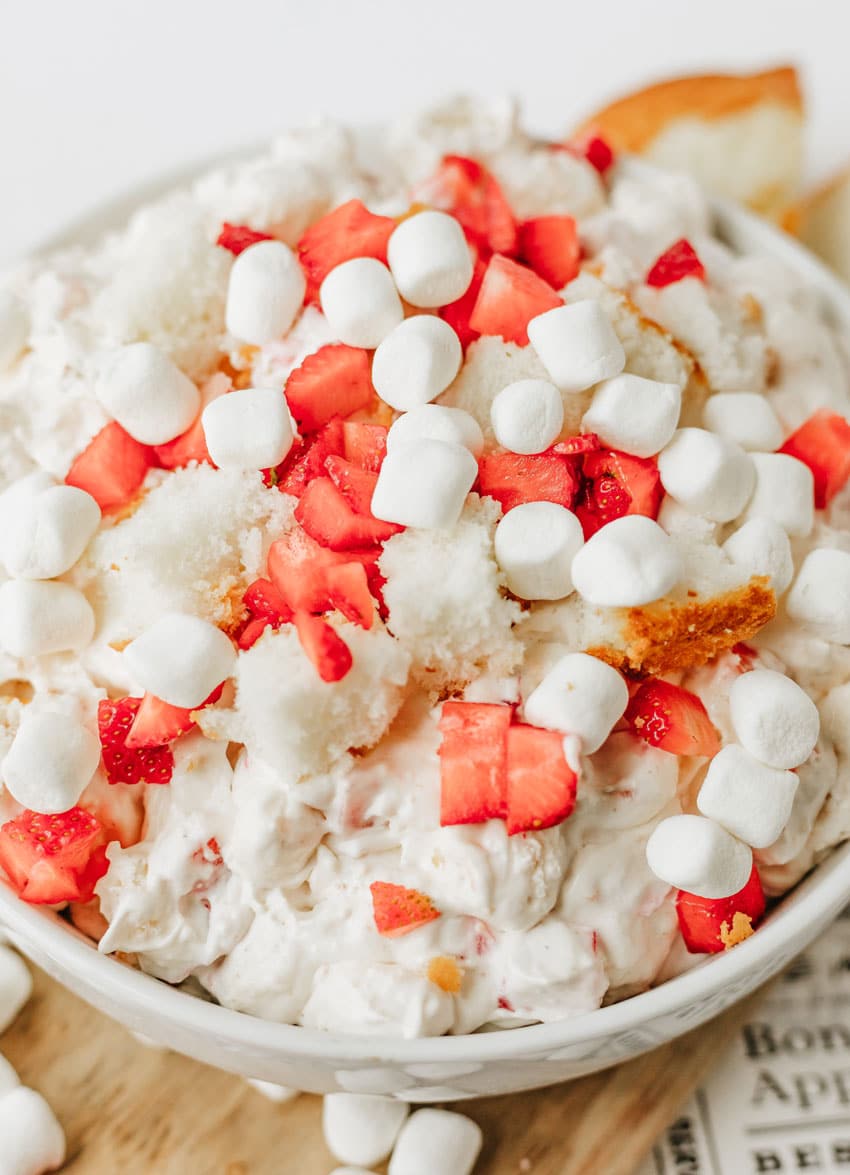 strawberry shortcake fluff salad in a white serving bowl
