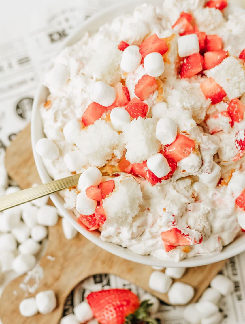 strawberry shortcake fluff salad in a white serving bowl