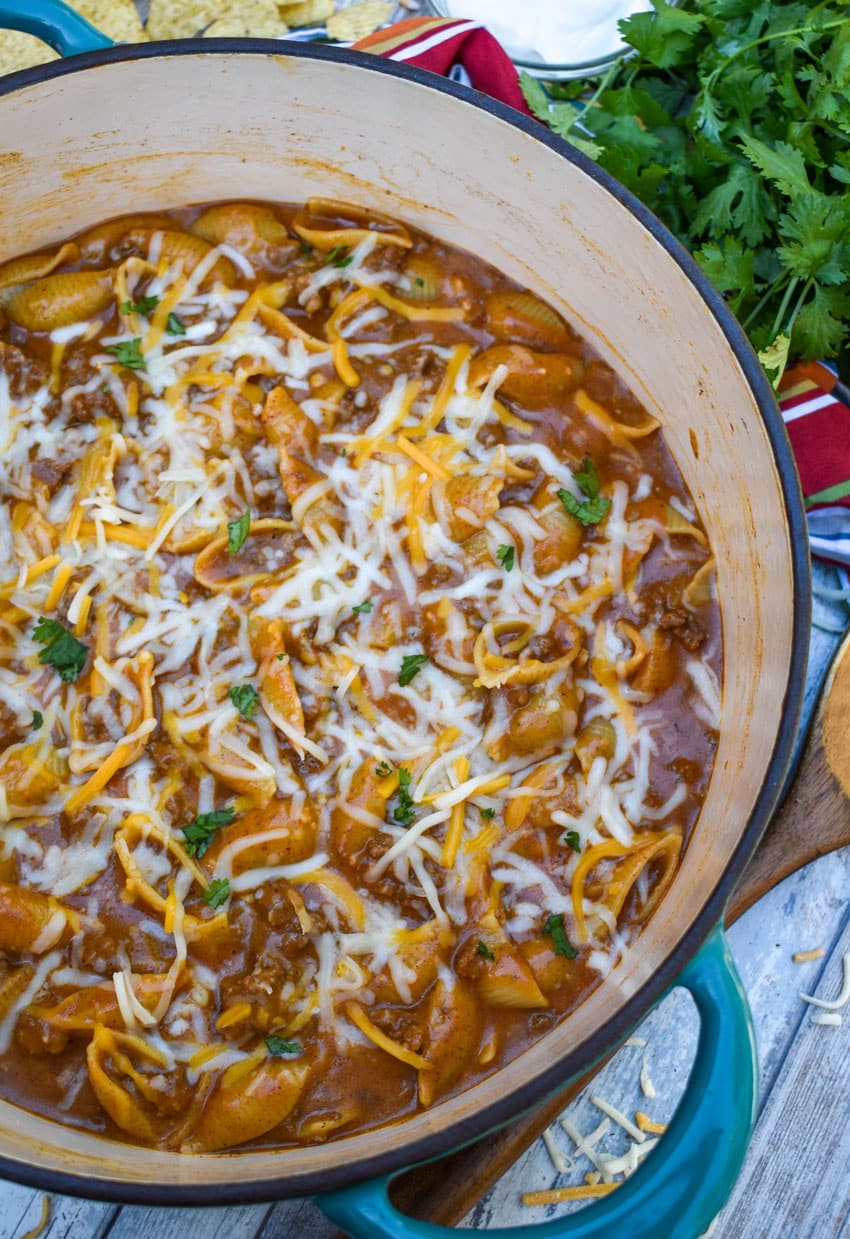 homemade cheesy enchilada hamburger helper pasta in a large dutch oven
