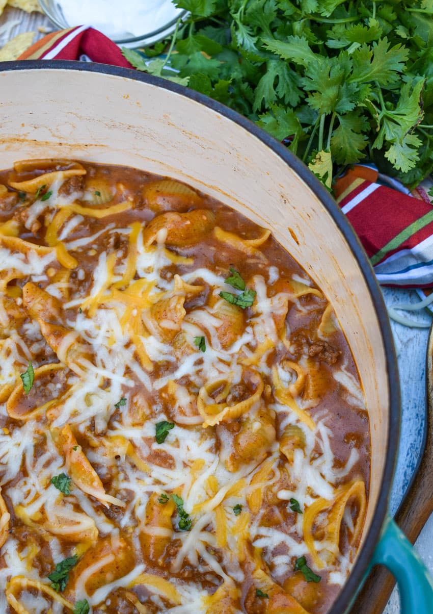 homemade cheesy enchilada hamburger helper pasta in a large dutch oven