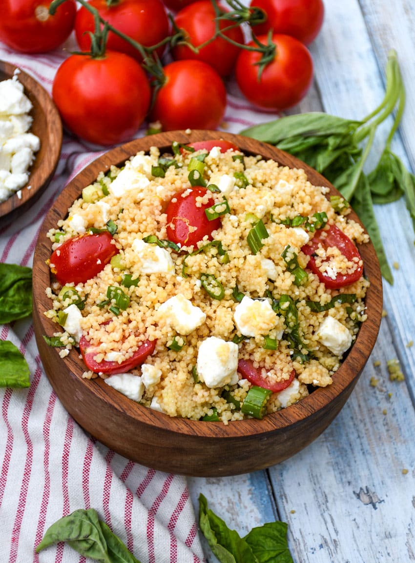 easy everything summer couscous salad in a wooden bowl