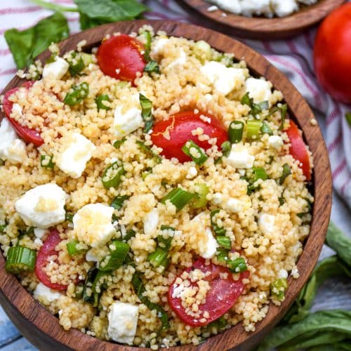 easy everything summer couscous salad in a wooden bowl