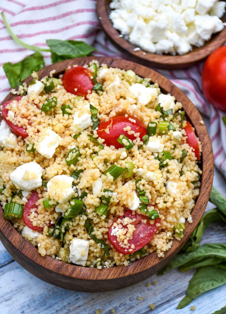 easy everything summer couscous salad in a wooden bowl