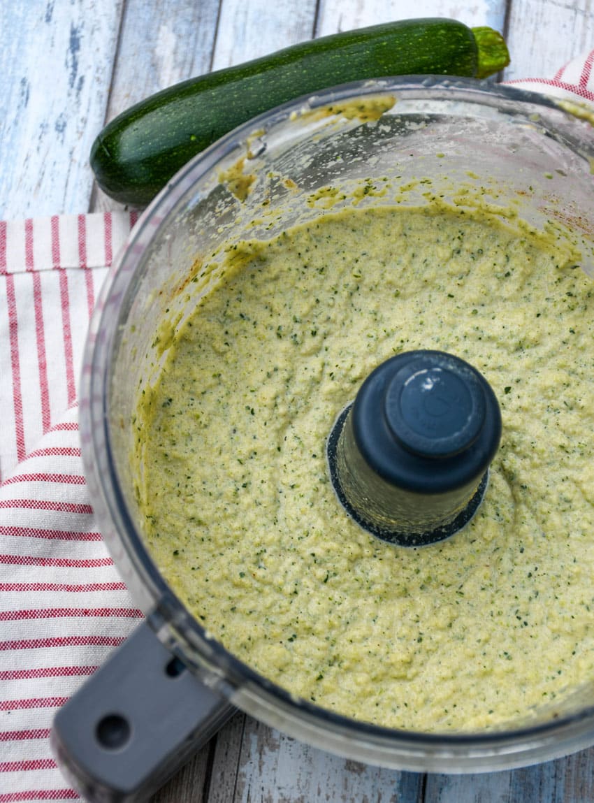 homemade zucchini hummus in the bowl of a food processor