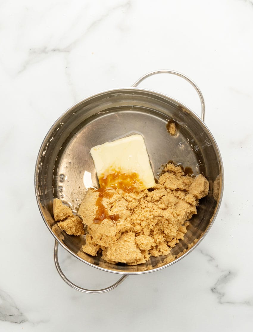 brown sugar and butter melting in a metal sauce pan