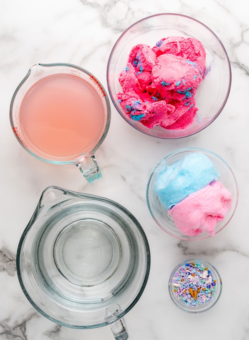 an overhead image showing the measured ingredients needed to make a batch of homemade cotton candy punch with ice cream