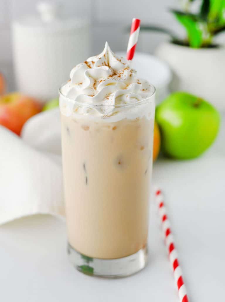 a copycat Starbucks iced caramel apple latte in a small glass jar