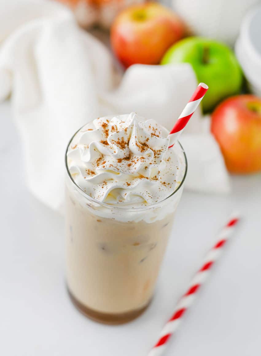 a copycat Starbucks iced caramel apple latte in a small glass jar