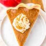 a slice of apple butter pie on a small white dessert plate