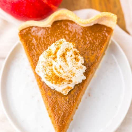 a slice of apple butter pie on a small white dessert plate