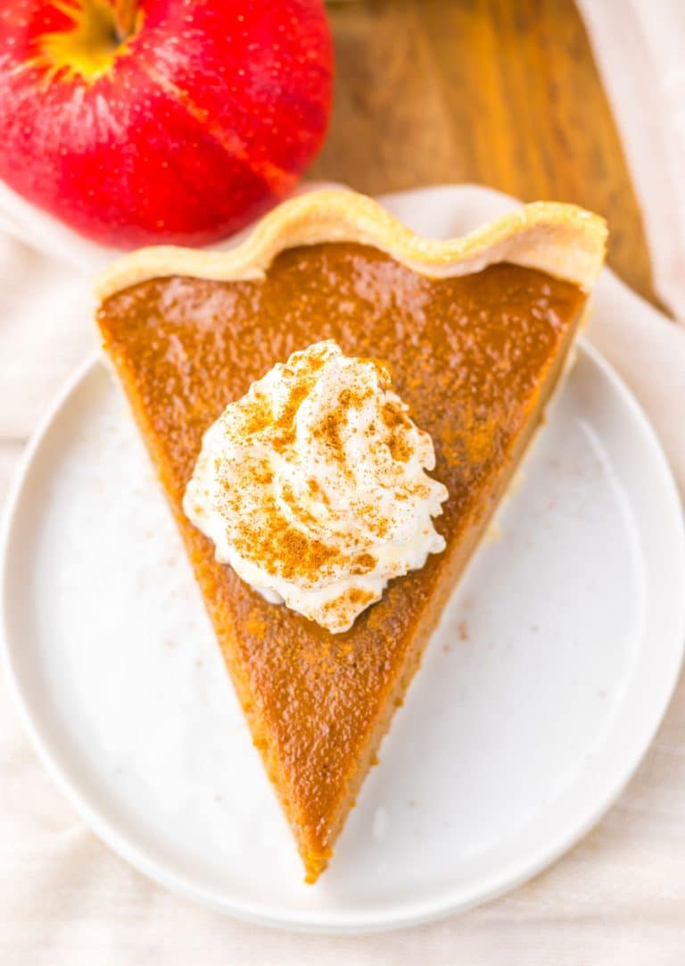 a slice of apple butter pie on a small white dessert plate