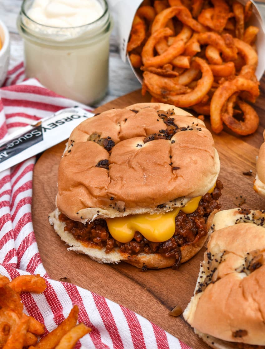 arby's beef n cheddar sloppy joes on a wooden serving tray