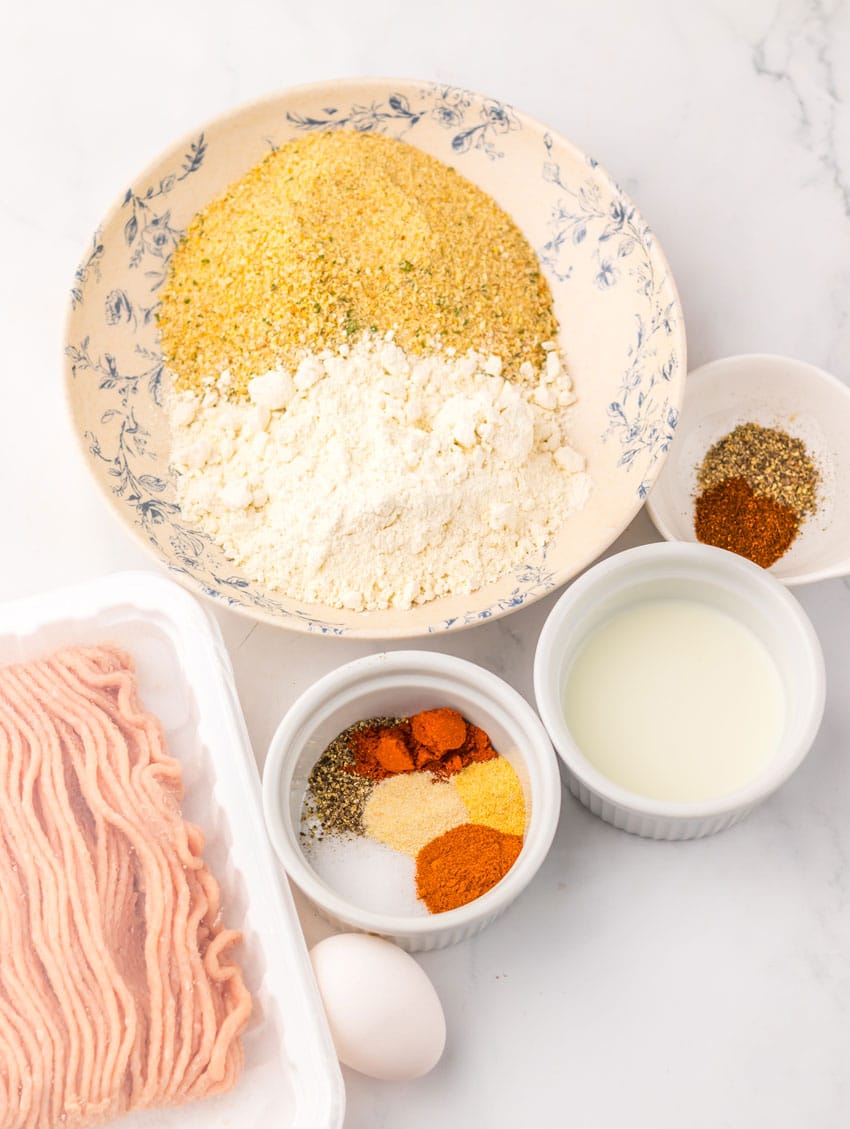 an overhead image showing the measured ingredients needed to make a batch of wendy's copycat spicy nuggets