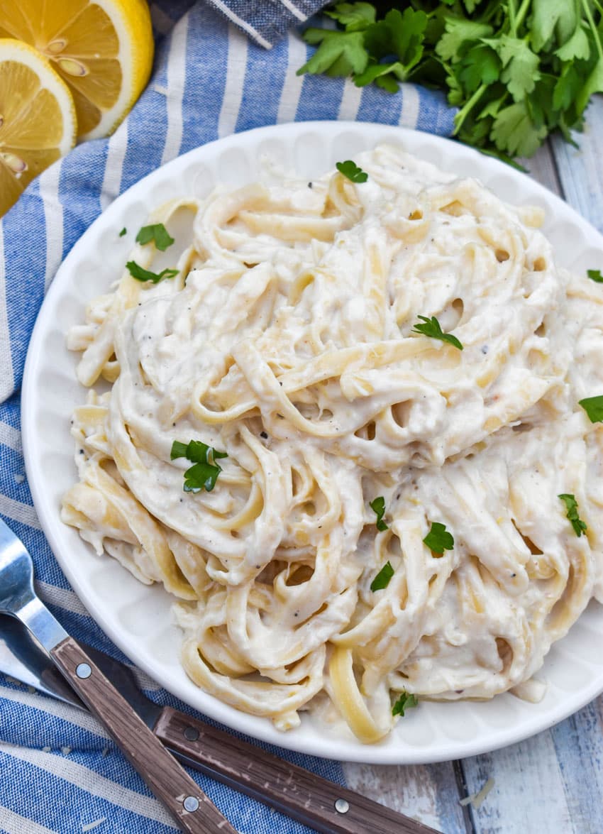 easy crab pasta on a small white plate