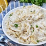 easy crab pasta on a small white plate