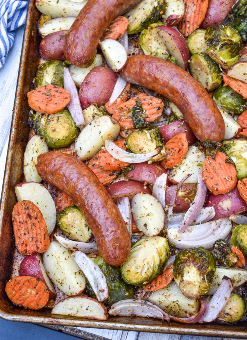 spicy Italian Sausage and roasted Vegetables on a metal baking sheet