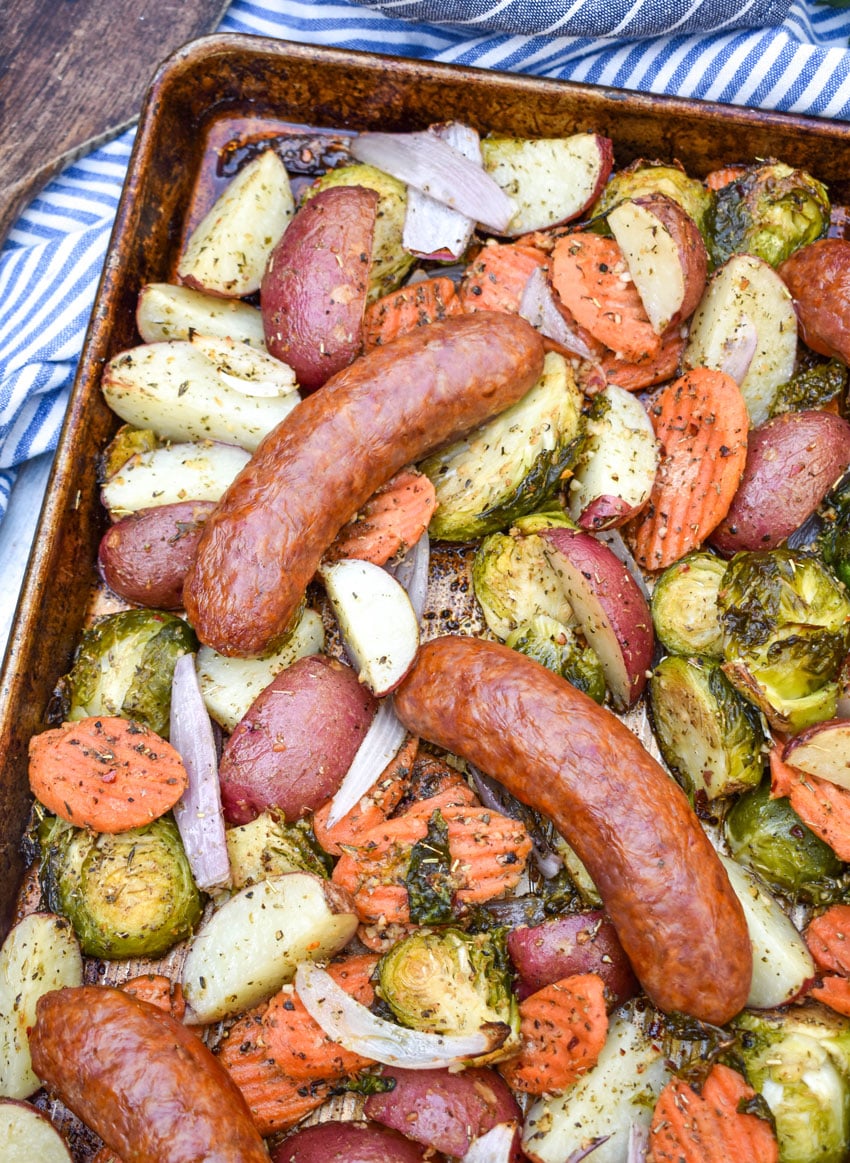 spicy Italian Sausage and roasted Vegetables on a metal baking sheet