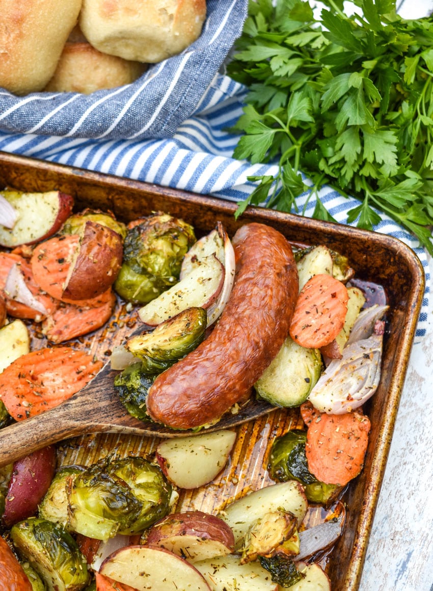 spicy Italian Sausage and roasted Vegetables on a metal baking sheet