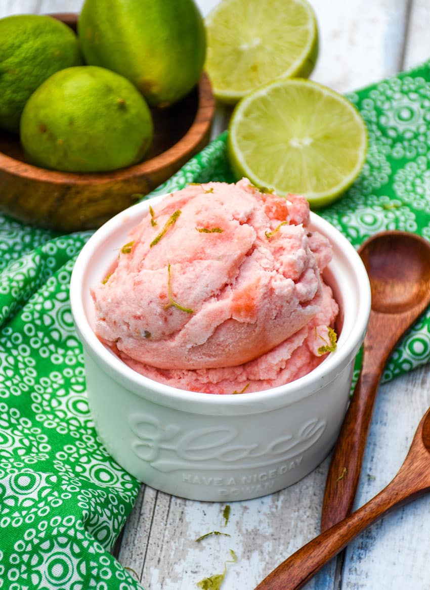 2 ingredient watermelon ice cream in a small white ramekin with small wooden spoons on the side