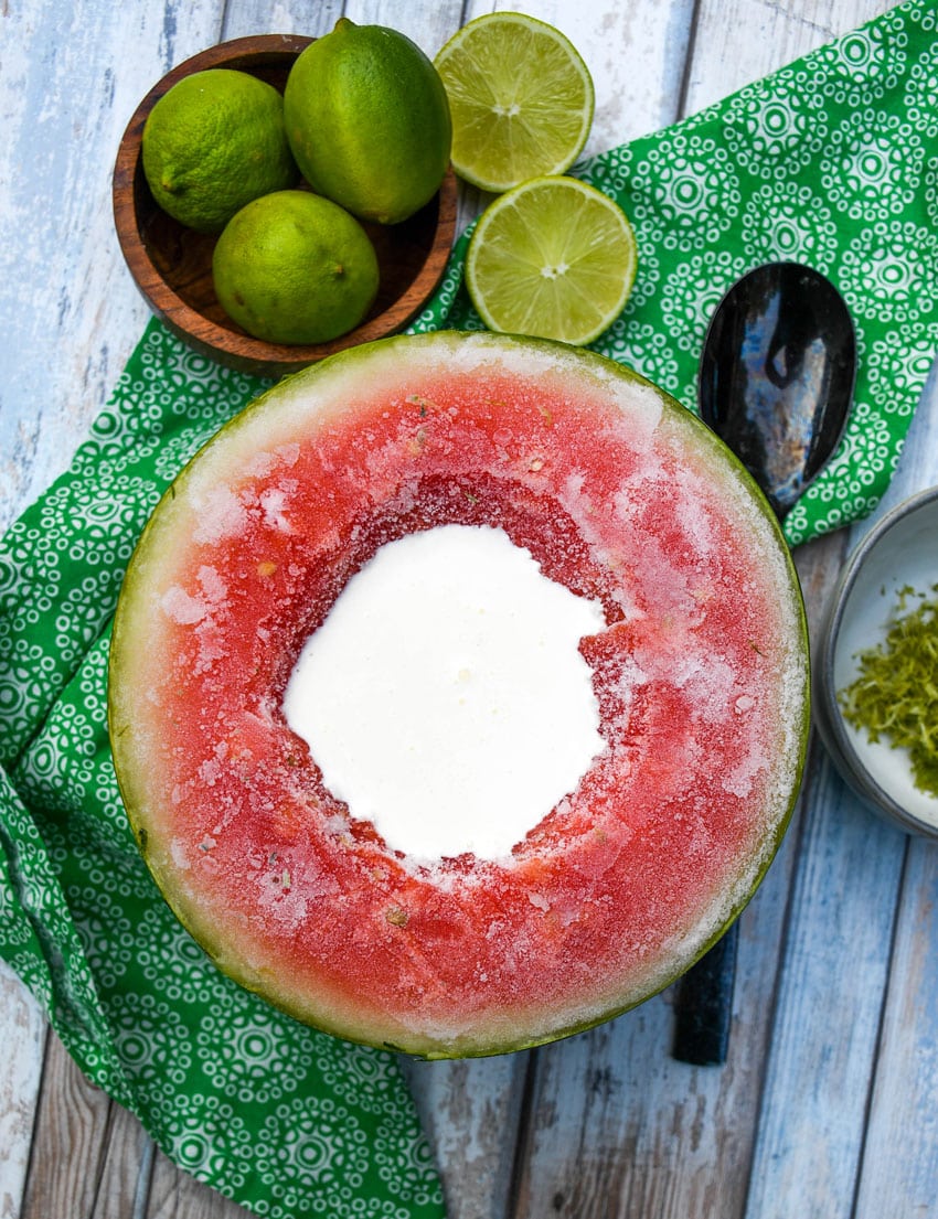 cream in a small well in the center of a frozen water melon half