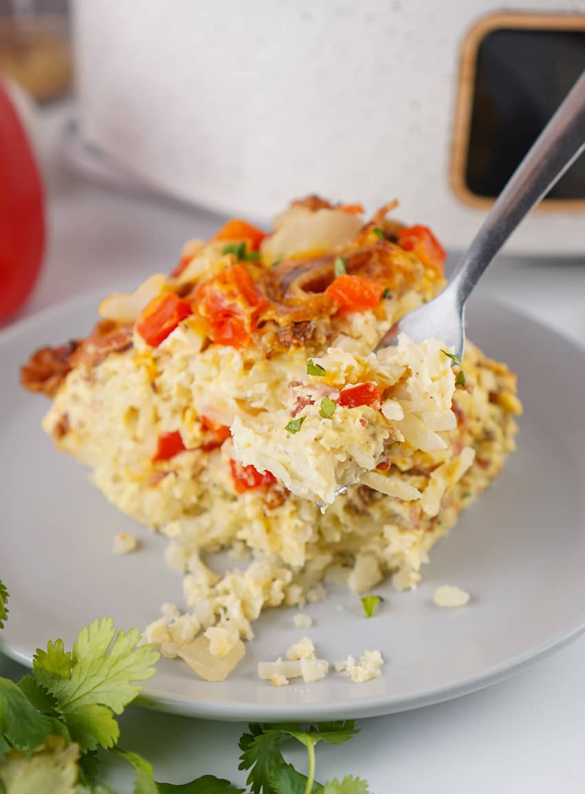 a slice of slow cooker breakfast casserole on a gray plate