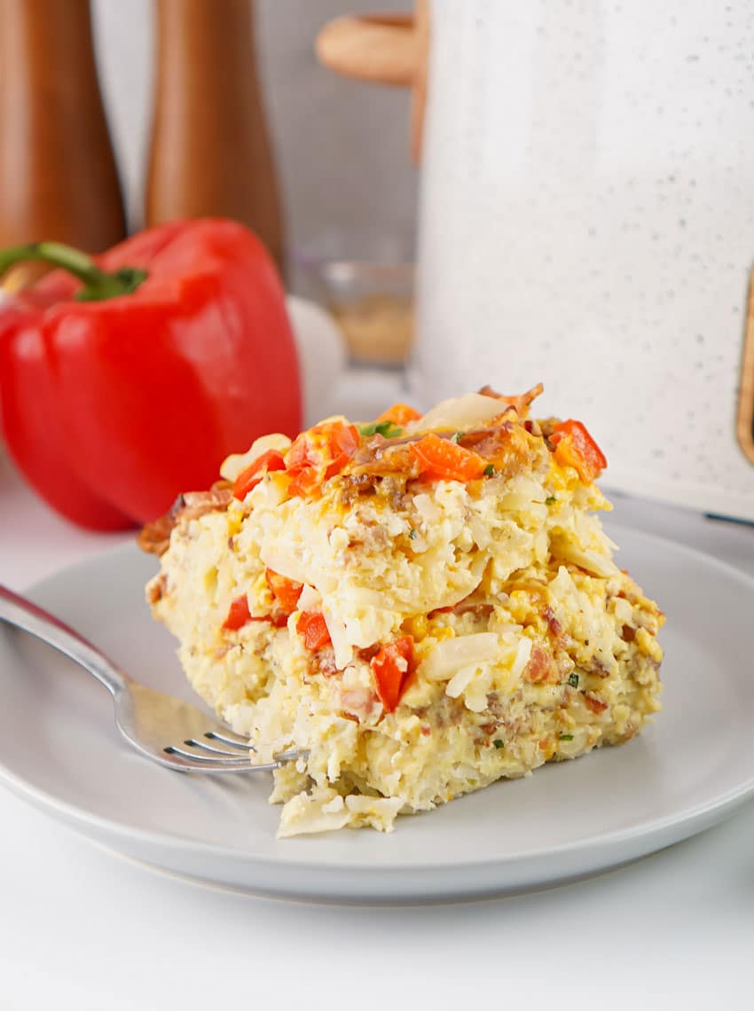 a slice of slow cooker breakfast casserole on a gray plate