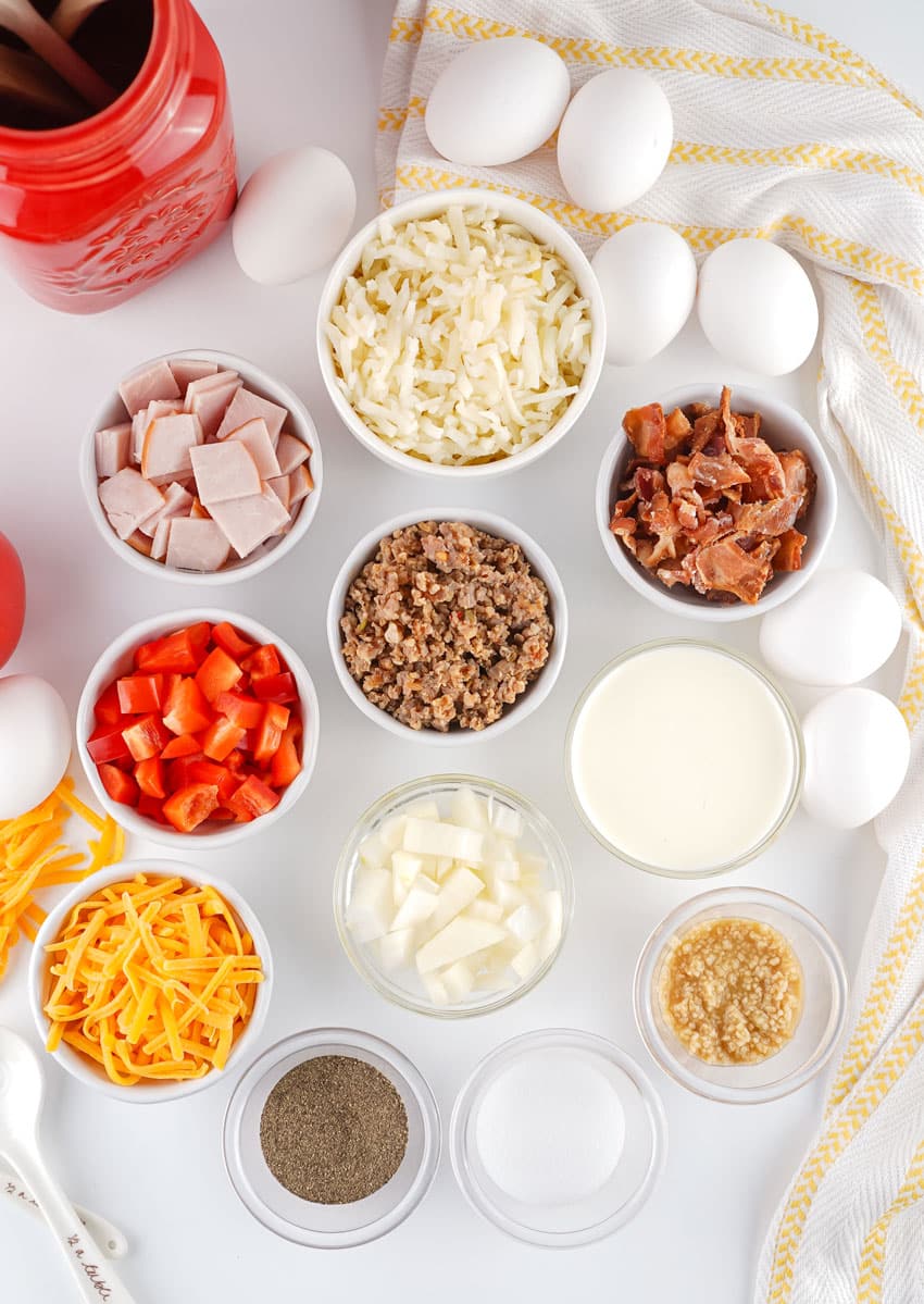 an overhead image showing the measured ingredients needed to make a crockpot breakfast casserole