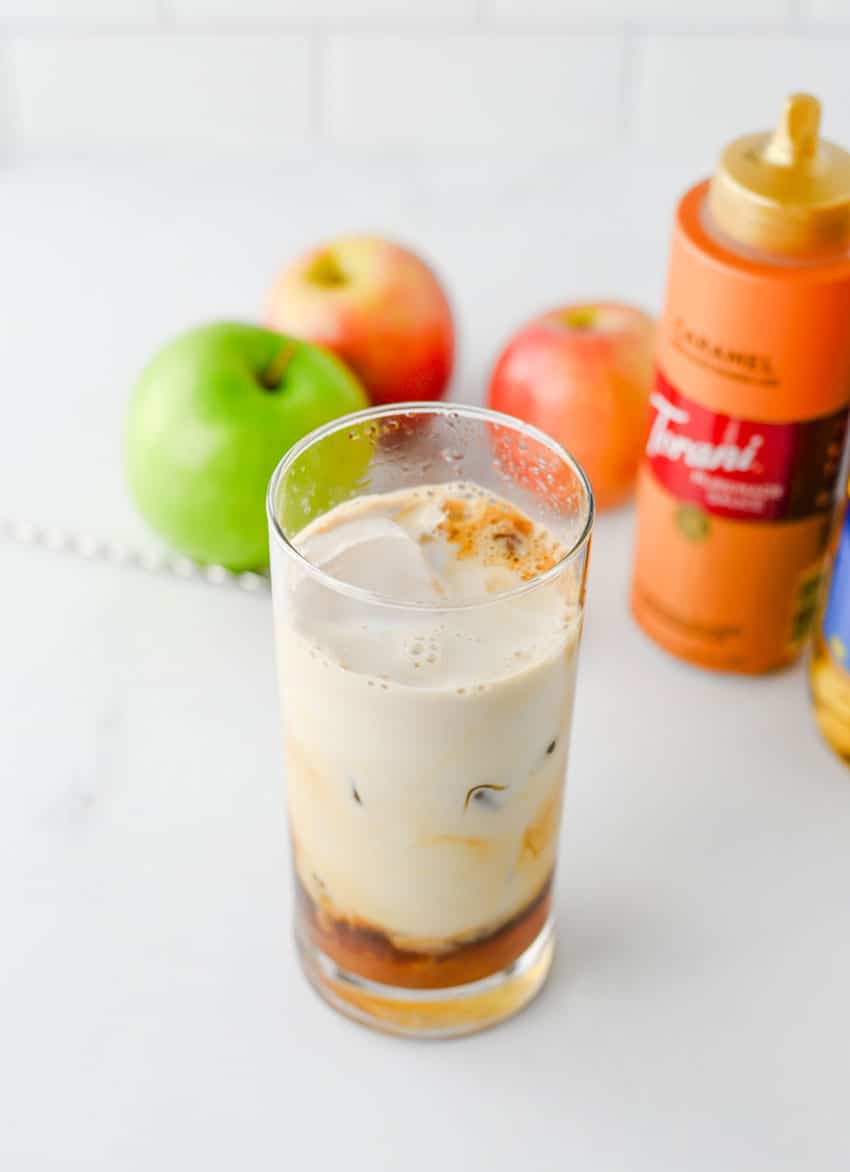ice caramel apple latte ingredients in a small glass jar