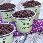 Frankenstein pudding cups on a wooden table