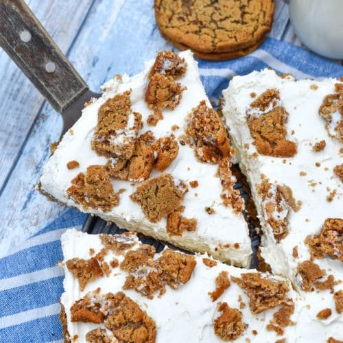 a wooden handled cake server lifting up a slice of no bake oatmeal creme pie cheesecake