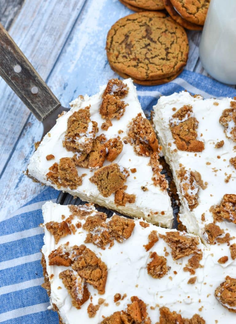 a wooden handled cake server lifting up a slice of no bake oatmeal creme pie cheesecake